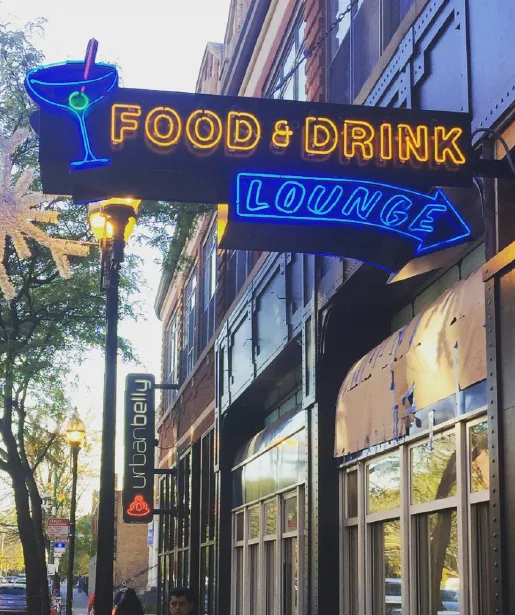 Projecting neon sign over a storefront